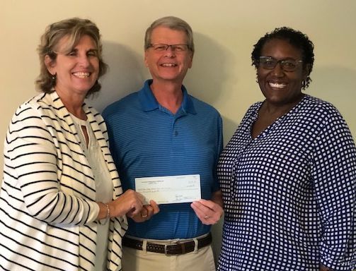 The Palms Foundation presents grant to NuHope